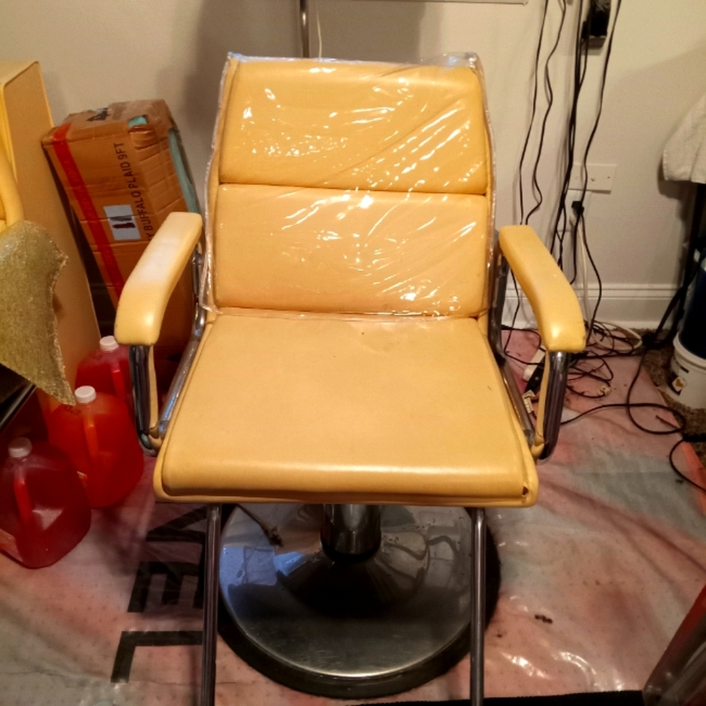 Stylist chair and professional hair dryer